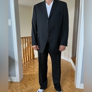 New with tags - never worn Hugo Boss suit purchased in Paris. Dark grey colour